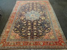 KASHAN CARPET, central Persia, 20th Century, central pale blue medallion on an indigo palmette and