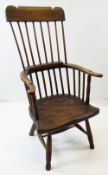 EARLY 19TH CENTURY PRIMITIVE WELSH ELM & OAK ARMCHAIR, with comb back, bent back rail, saddle seat