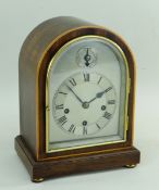 WINTERHALDER & HOFFMEISTER MANTEL CLOCK, mahogany and boxwood strung arched case with strike/
