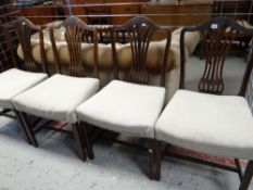 SET OF FOUR EARLY 19TH CENTURY SHERATON-STYLE MAHOGANY DINING CHAIRS, pierced waisted vase splats