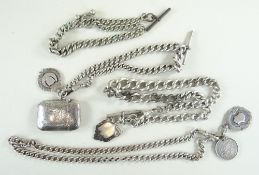 THREE SILVER CURB LINK ALBERT CHAINS, with swivel hooks, fobs, a vesta case and a 1887 shilling,