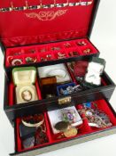ASSORTED COSTUME JEWELLERY comprising brooches, earrings ETC in a folding black leather jewellery