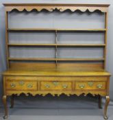 SHROPSHIRE OAK DRESSER, open back with four shelves, carved detail to upper frieze railback, three