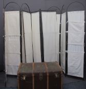 WOODEN BANDED TRAVEL TRUNK and three tri-fold metal and canvas screens, 188cms H, 126cms W the