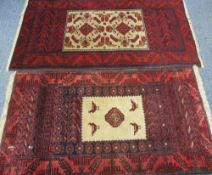 EASTERN STYLE WOOLLEN CARPETS (2) both red ground, similarly bordered, both with central bird