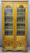 OAK BOOKCASE twin glazed and leaded upper doors, interior adjustable shelves over twin base doors