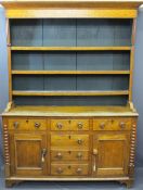 NORTH WALES OAK DRESSER with three shelf rack over three drawers, two base cupboards with three