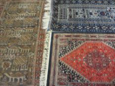 EASTERN WOOLLEN CARPETS (3) including a vintage red ground example with repeated central block