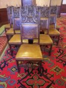 SET OF 11 CONTINENTAL CAROLEAN STYLE OAK DINING CHAIRS with carved mask crest rails and front
