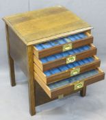 VINTAGE OAK FOUR DRAWER COIN COLLECTOR'S CABINET, the drop-down front opening to reveal four glass