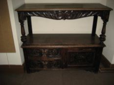 LATE 19TH CENTURY CARVED OAK BUFFET SIDEBOARD, the upper shelf having a carved and scrolled apron