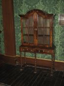 WALNUT DISPLAY CABINET, one piece of neat proportions, the top having a domed hood with twin