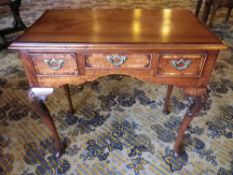 ANTIQUE CROSSBANDED MAHOGANY & WALNUT LOWBOY, the rectangular moulded edge top over three frieze