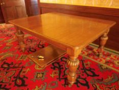 VICTORIAN OAK WIND-OUT DINING TABLE with rounded corner top and two additional slot-in leaves on