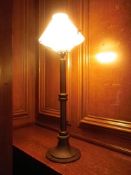 SIX REPRODUCTION CAST METAL LIBRARY LAMPS, streetlamp column style with white glass shades, 93cms
