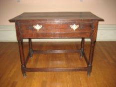 OAK SIDE TABLE, a twin plank oblong top with single narrow drawer having brass backplates and