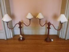 REPRODUCTION SCUMBLED METAL TWIN BRANCH LAMPS in the form of vintage wig stands with white glass