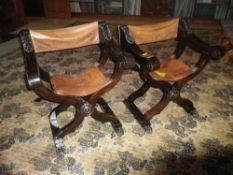 CONTINENTAL CARVED & STAINED WALNUT X FRAME CAMPAIGN TYPE FOLDING CHAIRS with leather seats and
