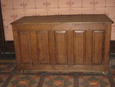 LATE 18TH CENTURY OAK DOWER CHEST having a four panel lid over a base having five narrow fielded