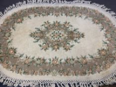 GANGES HANDMADE ALL WOOL PILE INDIAN CARPET, oval format, cream ground with full outer border and