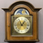 WALT REPRODUCTION WALNUT GRANDMOTHER CLOCK with moon face detail to an arched dial before a pendulum