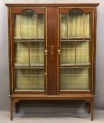 EDWARDIAN MAHOGANY TWO DOOR CHINA DISPLAY CABINET with boxwood and ribbon swag applied detail,