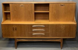 MID-CENTURY LONG TEAK SIDEBOARD with drop down top cupboards and central shelf over three central