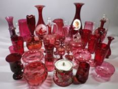 CRANBERRY & RUBY GLASS COLLECTION OF JUGS, decanters, bowls, vases and drinking glassware, 30 plus