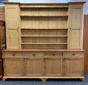 LARGE ANTIQUE PINE COUNTRY HOUSE KITCHEN DRESSER, boarded plate rack with flanking cupboards, a base