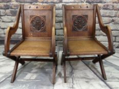 PAIR OF ARTS & CRAFTS OAK GLASTONBURY CHAIRS, square panelled backs carved with flowering lily
