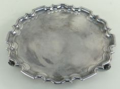 LARGE SILVER SALVER having pie crust edge raised on three scroll feet, Sheffield hallmarks, Walker &