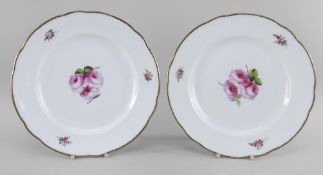 A PAIR OF NANTGARW PORCELAIN PLATES of lobed form, both painted with open pink roses and foliage,