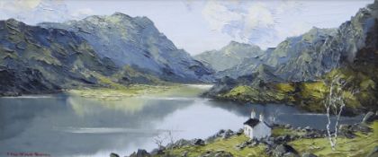 CHARLES WYATT WARREN oil on board - Eryri lake scene with white washed cottage, signed, 23 x 54cms