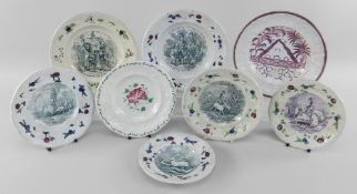 EIGHT YNYSMEUDWY POTTERY CHILDREN'S PLATES all with floral moulded borders, comprising two from a