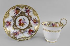A NANTGARW PORCELAIN CUP & SAUCER the footed bell shaped cup with elevated loop handle, both