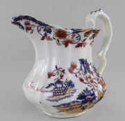 A LLANELLY SOUTH WALES POTTERY NAMED JUG of fluted form with twig handle, in transfer decorated in