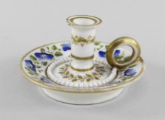 A RARE SWANSEA PORCELAIN MINIATURE TAPERSTICK of circular form with ring handle and stepped nozzle