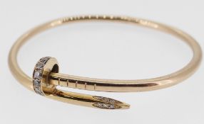 CARTIER 18CT GOLD DIAMOND SET 'JUSTE UN CLOU' BRACELET of coiled nail design with hidden clasp