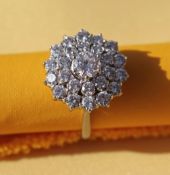 GRAFF 18CT WHITE GOLD DIAMOND CLUSTER RING, the central diamond (0.6cts approx.) surrounded by a