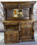FLEMISH RENAISSANCE-STYLE CARVED OAK CABINET, architectural mirror back top with male and female