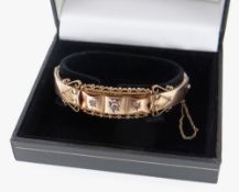 9CT GOLD DIAMOND SET BANGLE, scroll design, 13.4gms, in black box Condition Report: appears in