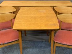 NATHAN TEAK DINING SUITE consisting long sideboard with central three drawers and outer cupboards,