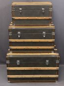 MODERN SET OF THREE VINTAGE STYLE STEAMER TRUNKS, leather effect with wooden banding, 46cms H, 81cms