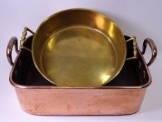 COPPER TWIN HANDLED BAKING PAN, 12cms H, 40cms W, 33cms D and a twin handled brass pan, 32cms
