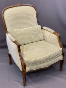 FRENCH STYLE WALNUT & UPHOLSTERED ARMCHAIR having striped, green upholstery and feather filled