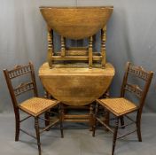 OAK BARLEY TWIST GATELEG DINING TABLE & ONE OTHER with two Edwardian cane seated side chairs,