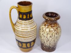 WEST GERMAN MARKED STUDIO POTTERY VASES, one with handle, 34cms H and 27cms H measurements