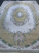 OLD ENGLISH STYLE EASTERN WOOLLEN CARPET, cream ground with yellow and floral oval cameo and