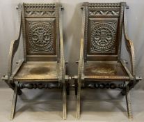 CARVED OAK CAMPAIGN STYLE ARMCHAIRS, A PAIR, pegged for dismantling construction with carved