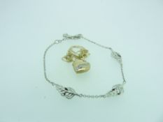 CLOGAU DEBUTANTE BRACELET & A 9CT GOLD HEART SHAPE LOCKET & CHAIN, the bracelet in three feather